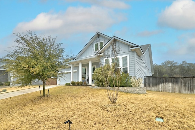 view of front of house featuring a garage and a front lawn