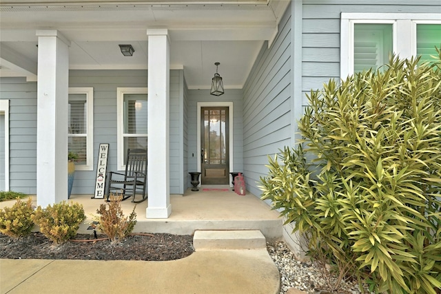 doorway to property with a porch