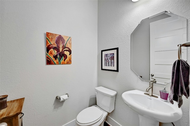 bathroom with toilet and sink