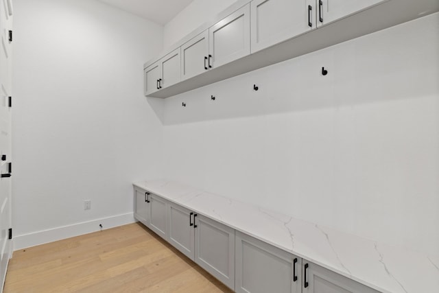 mudroom with light hardwood / wood-style floors