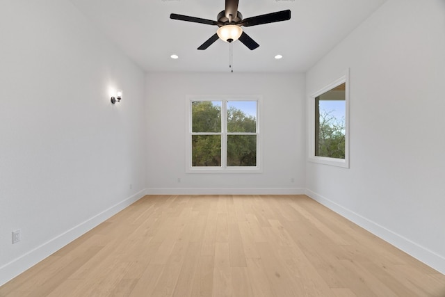 spare room with ceiling fan and light hardwood / wood-style floors