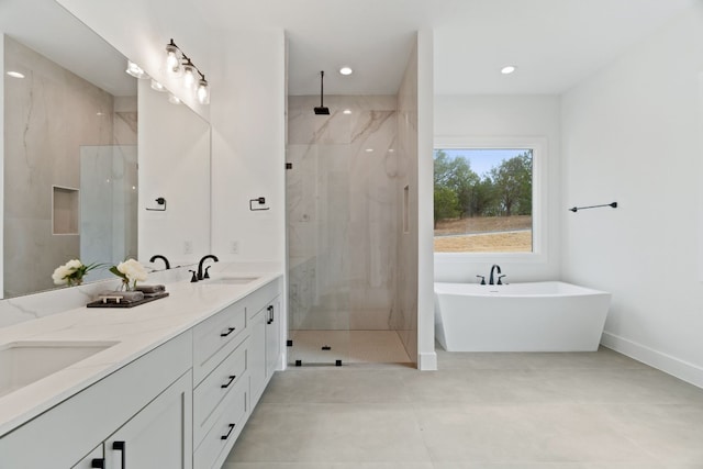 bathroom with vanity, independent shower and bath, and tile patterned flooring