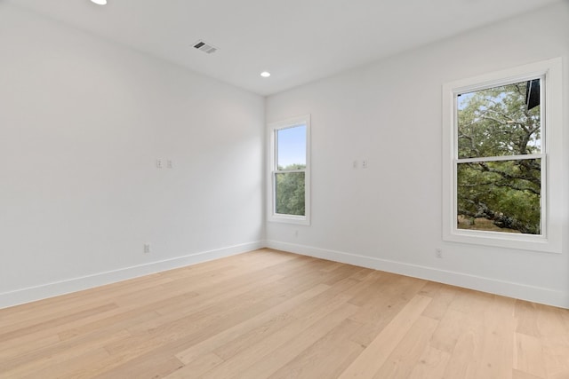 unfurnished room featuring light hardwood / wood-style flooring