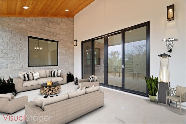 view of patio / terrace featuring an outdoor living space with a fire pit