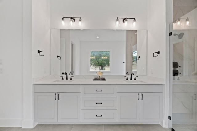 bathroom featuring an enclosed shower and vanity