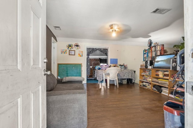 living room with dark wood-type flooring