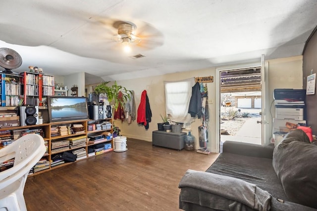 living room with hardwood / wood-style flooring and ceiling fan