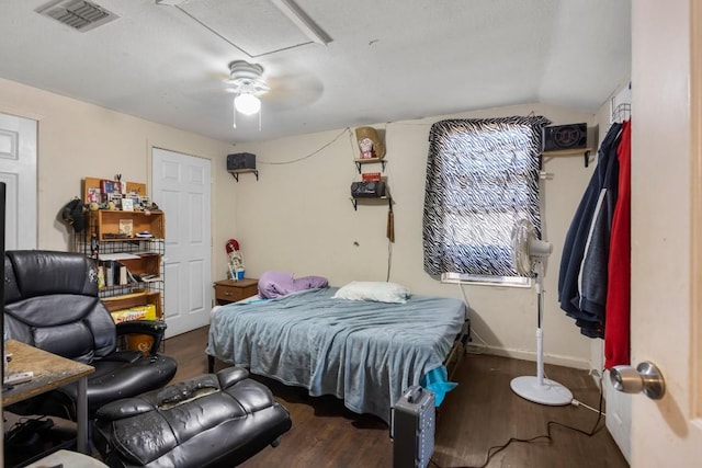 bedroom featuring lofted ceiling, dark hardwood / wood-style floors, and ceiling fan