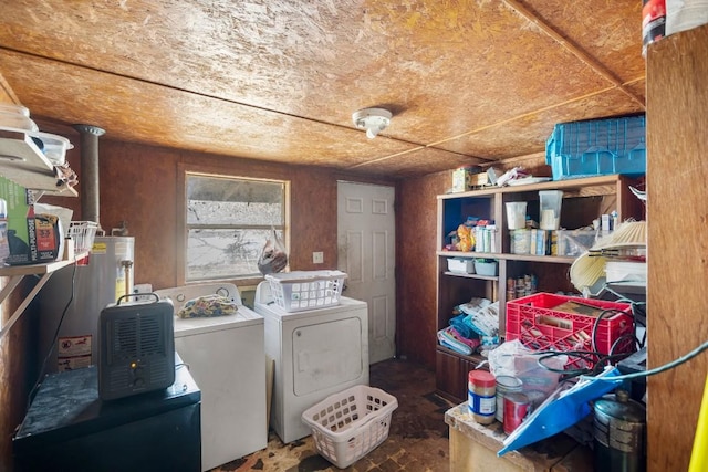 washroom with water heater and washer and clothes dryer