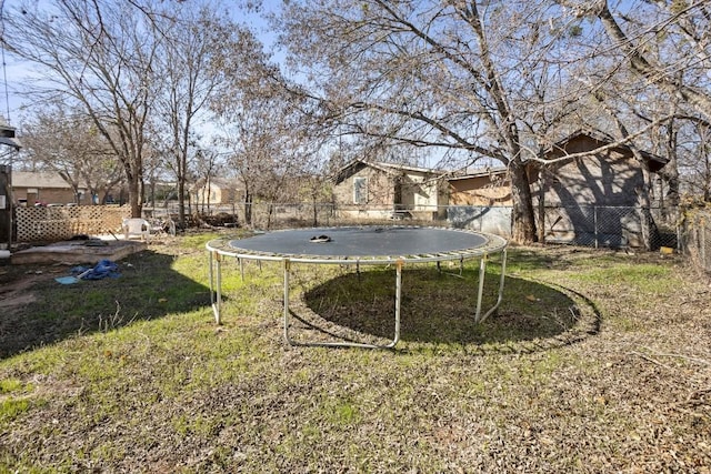 view of yard with a trampoline