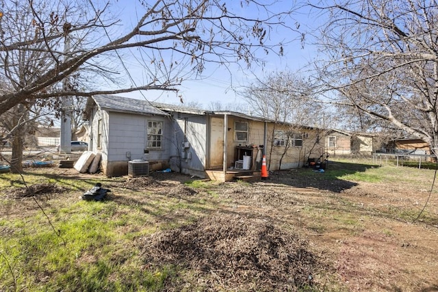 back of house with central AC