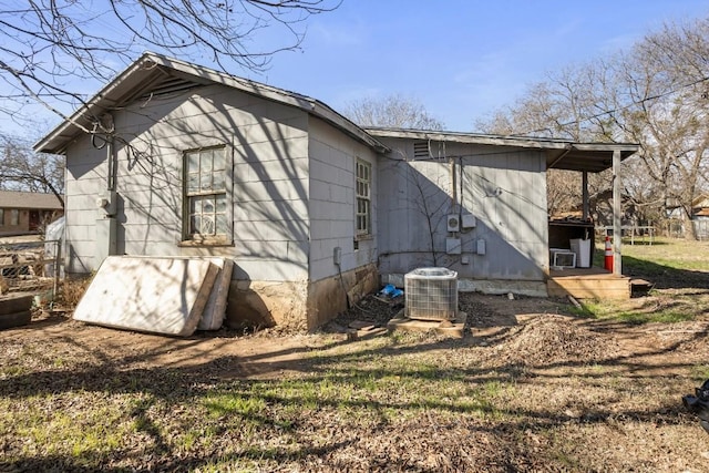 view of side of property featuring cooling unit