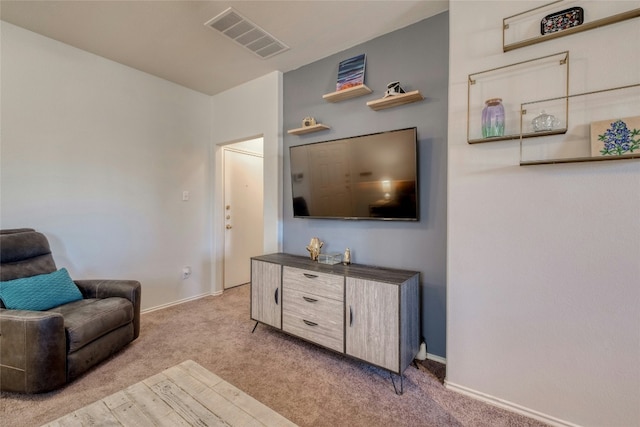 living area with light colored carpet