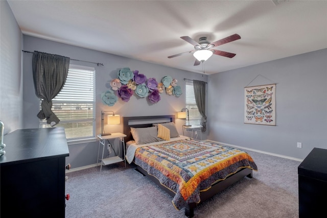 bedroom with multiple windows, carpet, and ceiling fan