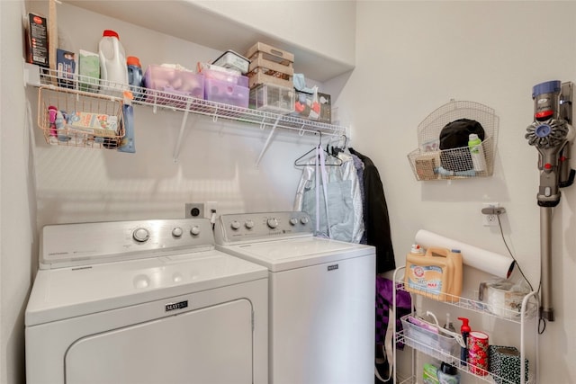 clothes washing area with washer and clothes dryer