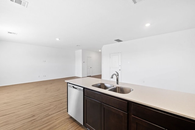 117 Citrine Crst, Maxwell, TX 78656 - kitchen with stainless steel dishwasher, light countertops, recessed lighting, light wood-style floors, and dark brown cabinets