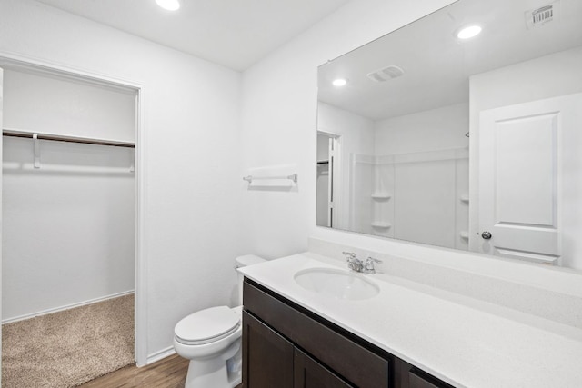117 Citrine Crst, Maxwell, TX 78656 - full bath with vanity, recessed lighting, a walk in closet, and wood finished floors