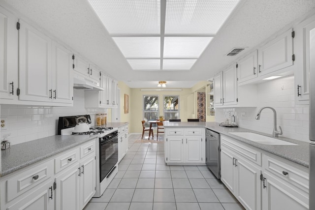 kitchen with light tile patterned flooring, white cabinetry, sink, stainless steel dishwasher, and gas range oven