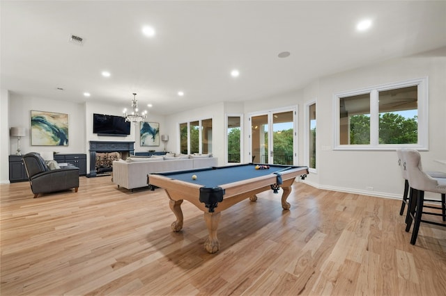 playroom with pool table and light hardwood / wood-style floors