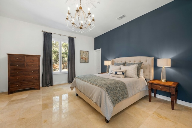 bedroom featuring a notable chandelier