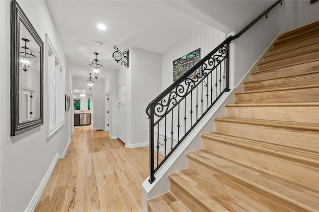 entryway with hardwood / wood-style flooring