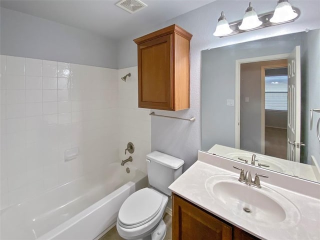 full bathroom featuring vanity, tub / shower combination, and toilet