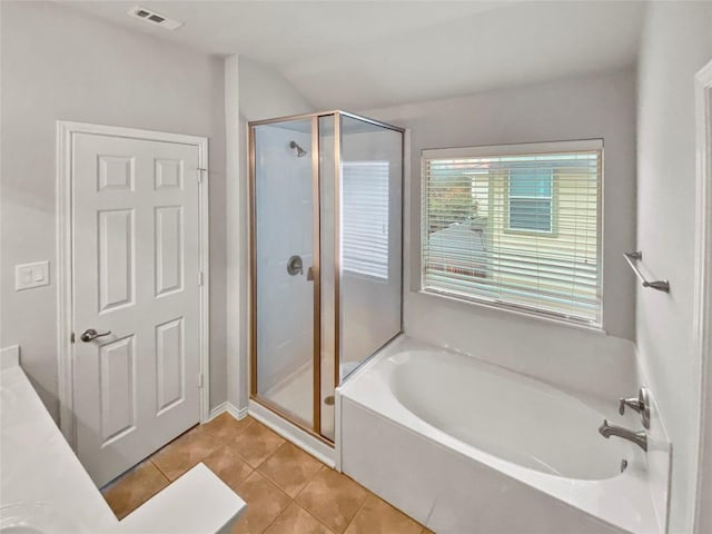 bathroom with tile patterned floors, shower with separate bathtub, and vanity