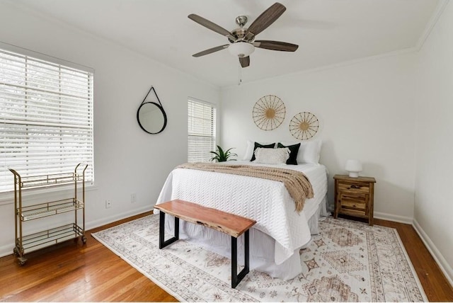 bedroom featuring ceiling fan and hardwood / wood-style floors