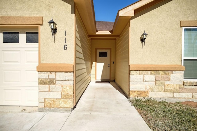 entrance to property featuring a garage