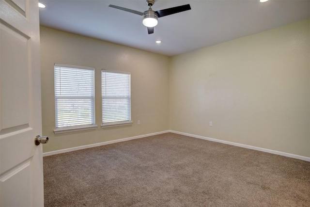 carpeted empty room with ceiling fan