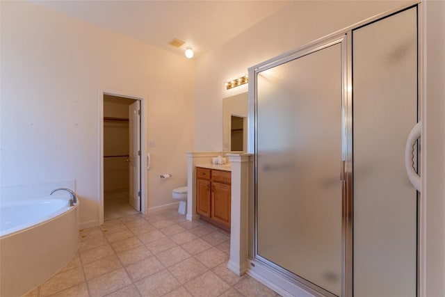 full bathroom with vanity, tile patterned floors, toilet, and separate shower and tub