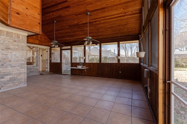 unfurnished sunroom featuring wood ceiling, ceiling fan, and lofted ceiling