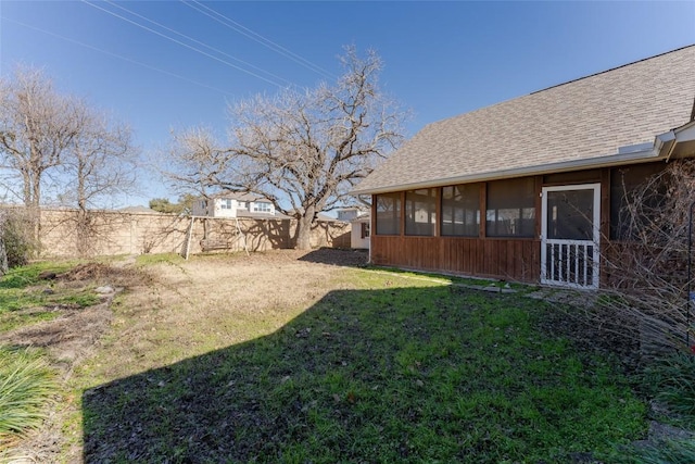 view of yard featuring a sunroom