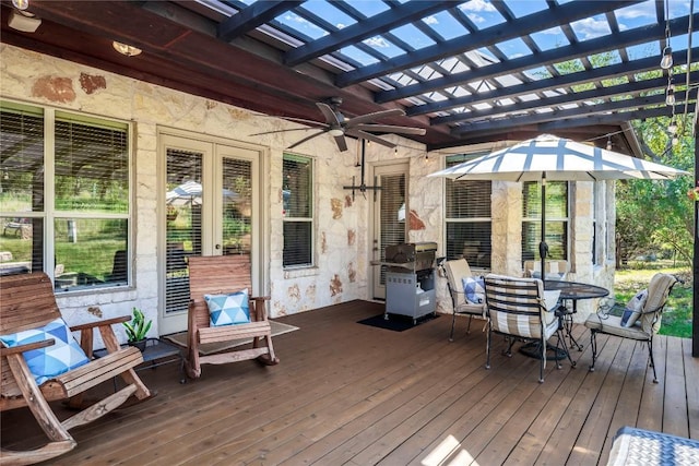 wooden terrace featuring a pergola and ceiling fan