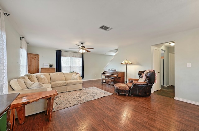 living room with ceiling fan and dark hardwood / wood-style floors