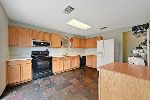 kitchen with sink, light brown cabinets, and black appliances