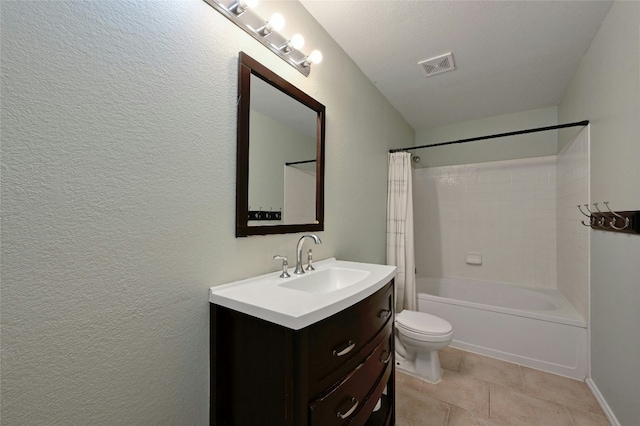 full bathroom with shower / tub combo, vanity, toilet, and tile patterned flooring