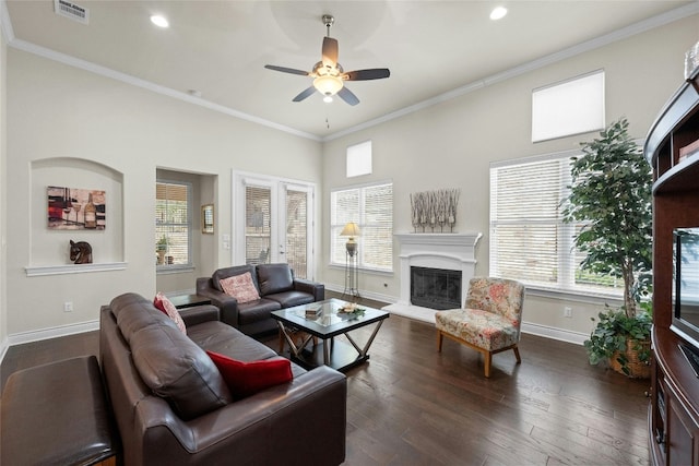 living room featuring ceiling fan, ornamental molding, and dark hardwood / wood-style floors