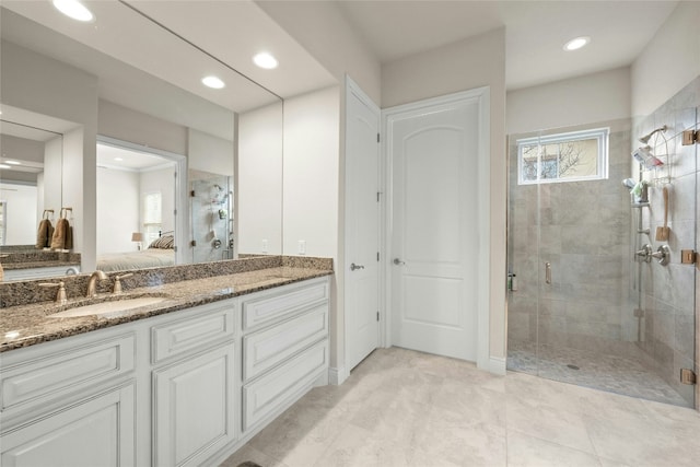 204 Delfino Cir, Lakeway, TX 78734 - ensuite bathroom featuring a stall shower, double vanity, and recessed lighting
