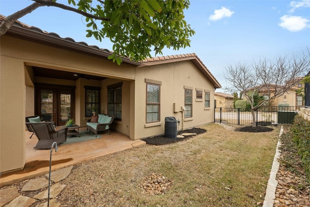 204 Delfino Cir, Lakeway, TX 78734 - back of house with stucco siding, a patio area, and a tile roof