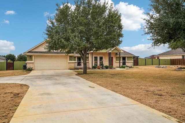 view of front of home featuring a garage and a front yard