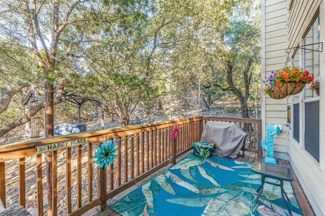 deck featuring a grill