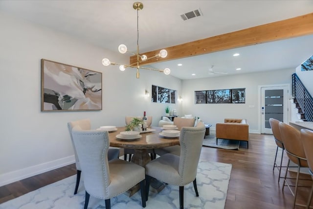 dining space featuring ceiling fan, beam ceiling, and dark hardwood / wood-style flooring