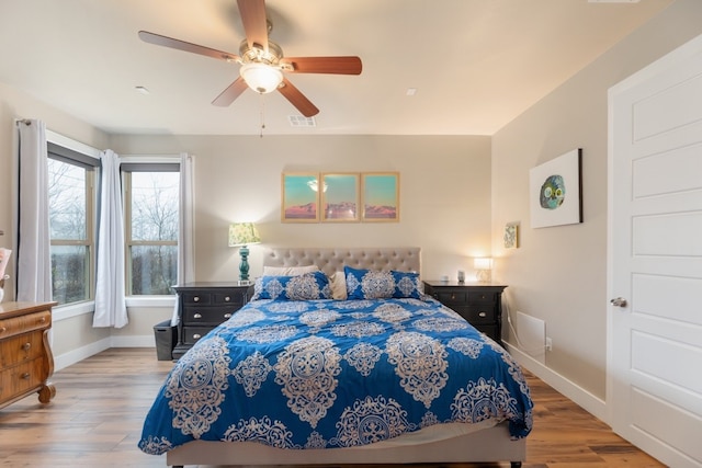 bedroom featuring light hardwood / wood-style floors and ceiling fan