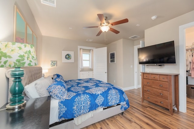 3301 Rockhurst Ln, Austin, TX 78723 - bedroom featuring wood finished floors, a ceiling fan, and connected bathroom