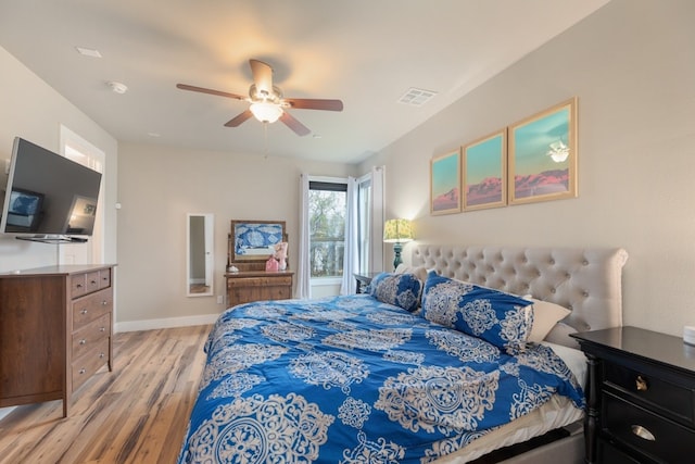 bedroom with ceiling fan and light wood-type flooring