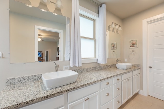 3301 Rockhurst Ln, Austin, TX 78723 - full bathroom featuring double vanity, tile patterned floors, and a ceiling fan