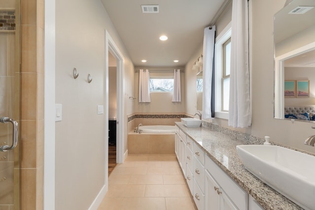 bathroom with vanity, shower with separate bathtub, and tile patterned flooring