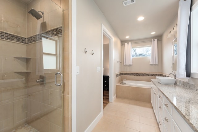 bathroom with vanity, tile patterned floors, and separate shower and tub