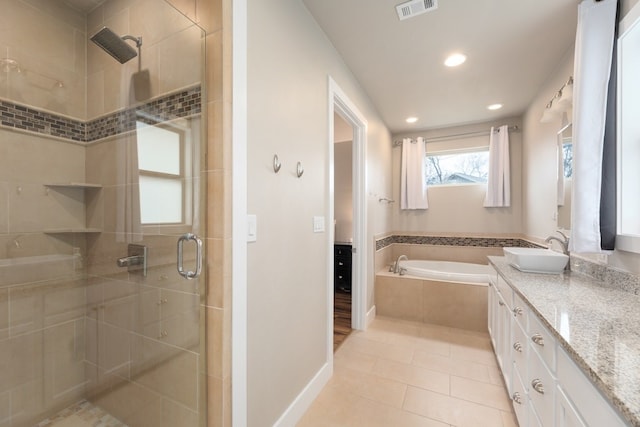 3301 Rockhurst Ln, Austin, TX 78723 - full bathroom with a shower stall, vanity, a bath, recessed lighting, and tile patterned floors